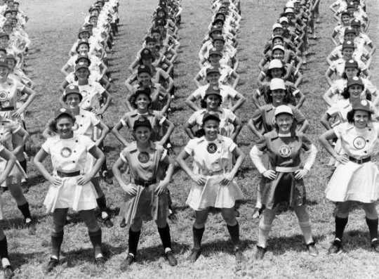 All American Girls Professional Baseball League members performing calisthenics in Opalocka, Florida. Black and White photo