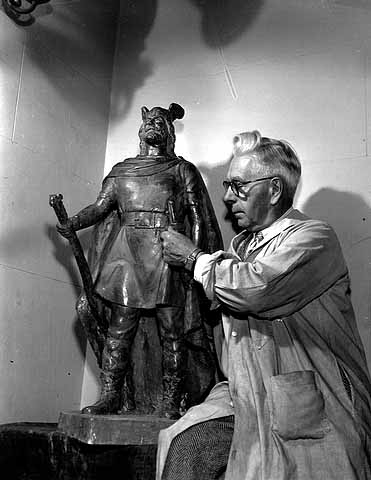 Sculptor John Karl Daniels with a model of his Leif Erikson statue