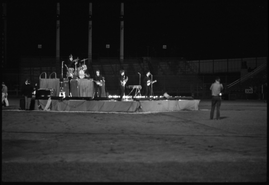The Beatles performing at Metropolitan Stadium