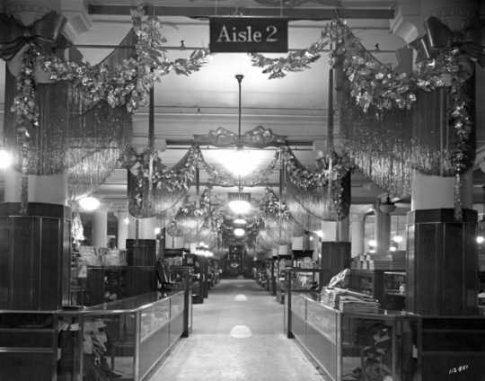 Black and white photograph of the main floor decorated for Christmas, c.1935.