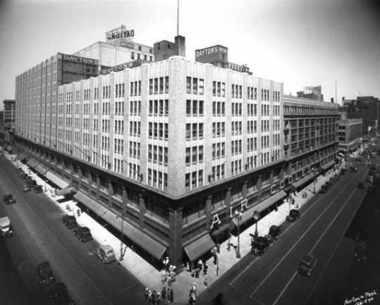 Black and white photograph of the expanded downtown store complex, c.1938. The  original store is in the darker shade. 