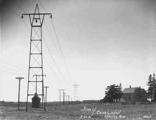 Black and white photograph of rural electrical transmission lines on the farm of Oscar Lindahl, Schaefer, Chisago County, 1931. Photograph by Norton & Peel.
