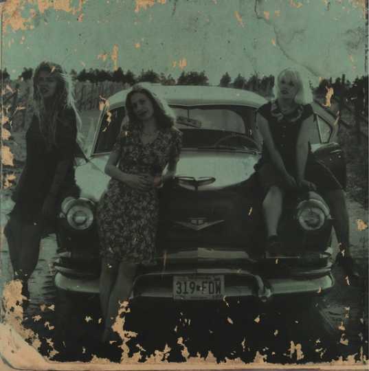 Babes in Toyland (left to right): drummer Lori Barbero, bassist Maureen Herman, and vocalist/guitarist Kat Bjelland. The image was used for promotional materials related to the release of the band’s 1995 album Nemesisters.