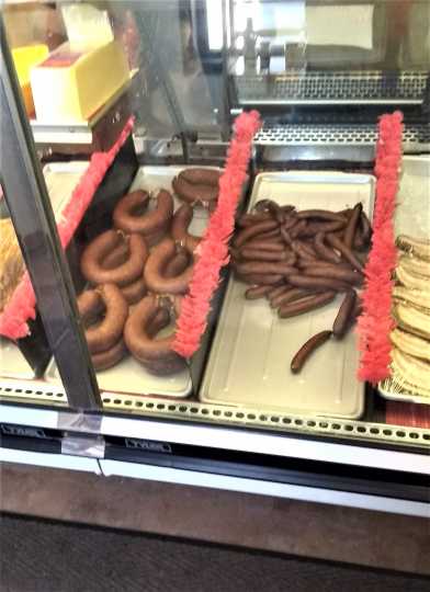 Meat case containing bologna and wieners inside Nerstrand Meats and Catering, 2019. Photo by Jeff M. Sauve.