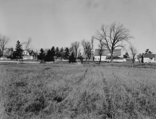 Black and white photograph of the Meeker County farm of the Charles Ness family, 1947.