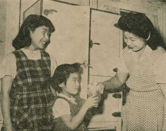 Mrs. Thomas Yamazaki with her daughters Luanne (left) and Aveline (right) at the St. Paul Resettlement Hostel