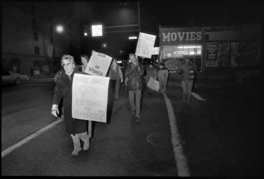 Black and white photograph of a Anti-pornography protest on Lake Street, 1984.