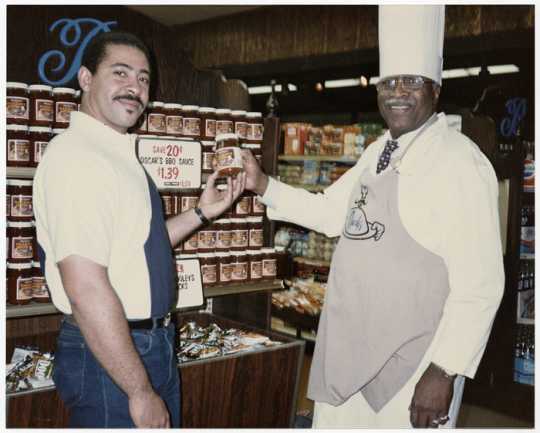 Oscar C. Howard (right) and a Byerly’s grocery store employee near a display of Chef Oscar’s BBQ Sauce, ca. 1980s. Oscar C. Howard papers, 1945–1990 (P1842), Cafeteria and Industrial Catering Business, 68601, Manuscripts Collection, Minnesota Historical Society, St. Paul.