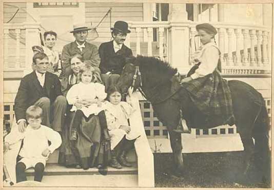 Photograph of the Ueland family and a pony near their Minneapolis home, ca. 1895.