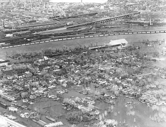 Black and white aerial view of West Side during flood, 1952.