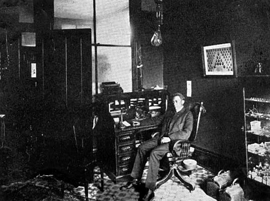 Black and white photograph of Dr. Valdo Turner in his office, c.1915.