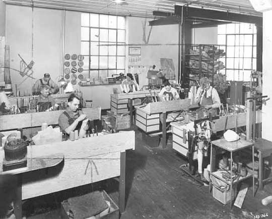 Black and white photograph of a work room, Minneapolis Artificial Limb Company, 1940.
