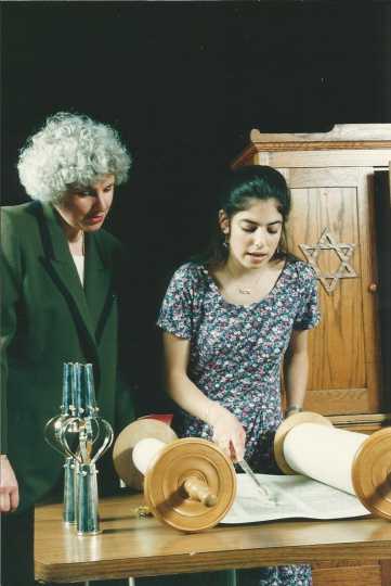 Color photograph of Rabbi Stacy Offner with a congregant of Shir Tikvah Synagogue.