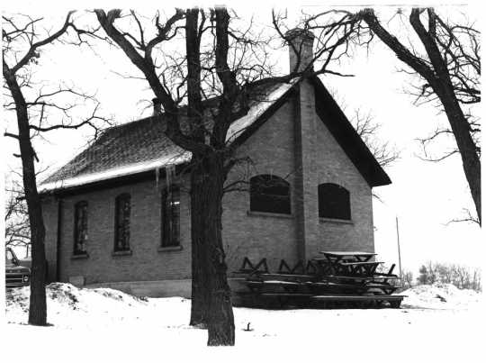 Photograph of the Ramsey District #28 School House after it was repurposed as the Ramsey Town Hall. Photographer unknown, ca. 1970s. Public domain.
