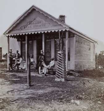 Black and white photograph of the first real estate office in Minneapolis, c.1855.