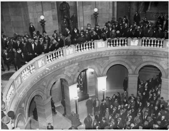 Black and white photograph of thousands of farmers gathering at the Minnesota State Capitol to hear Governor Floyd B. Olson talk on farm relief, ca. 1935.