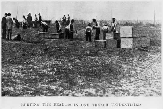 Burying ninety victims in one trench following the Hinckley fire, September, 1894. 