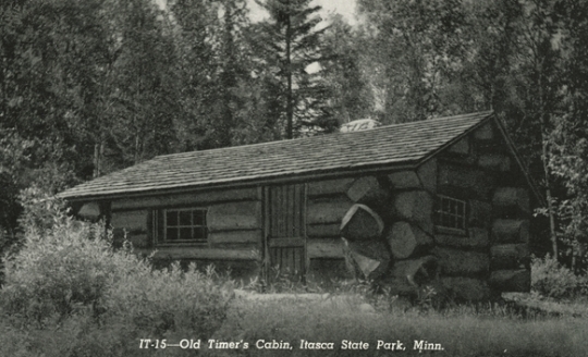 Black and white photograph of a cbin in Itasca State Park built by the Civilian Conservation Corps, ca. 1940.