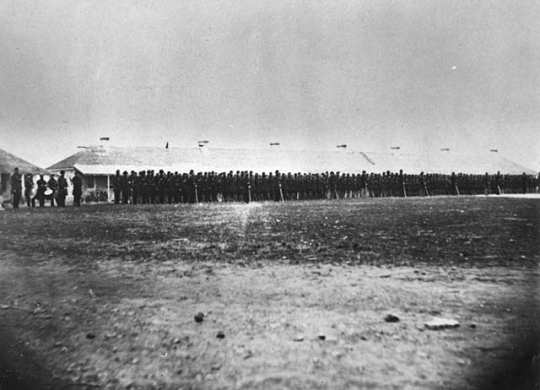Second Minnesota Volunteer Infantry standing in front of the Long Barracks