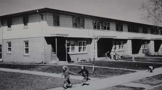 Children playing in front of Glendale Townhomes, ca. 1960s. Photographer unknown. Film still from Interstate 94: A History and Its Impact (Twin Cities PBS, April 1, 2017), 17:45.