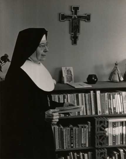 Black and white photograph of Alice Gustava Smith (Sister Maris Stella) in her office at the College of St. Catherine, c.1970. 