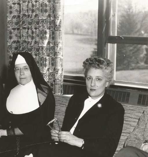 Black and white photograph of Alice Gustava Smith (Sister Maris Stella, left) with May Sarton (right), c.1958.