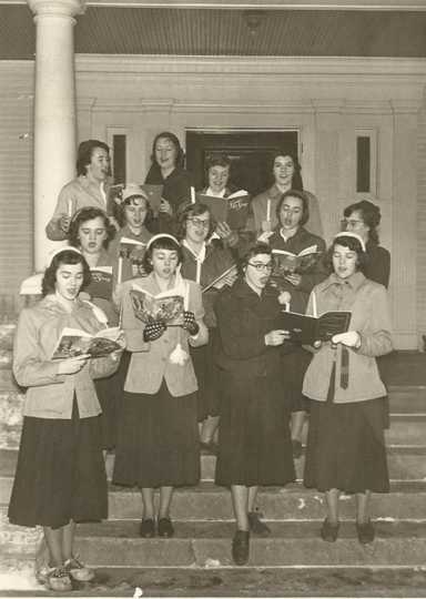 Black and white photograph of Holiday carolers at St. Joseph’s Academy, c.1950. 