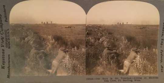 Black and white stereoview of officers-in-training in a trench during a drill at Fort Snelling, ca. 1917.