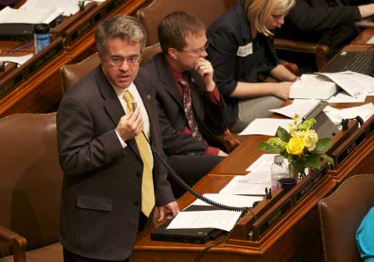 Color image of Minnesota Representative Terry Morrow (DFL) speaking on the House floor against SF 1308, 2011.