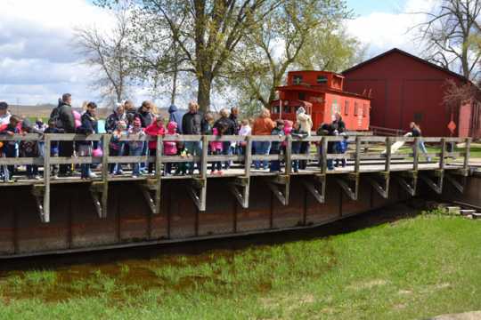 Color image of a tour group at End-O-Line Railroad Park in Currie, May 2014.