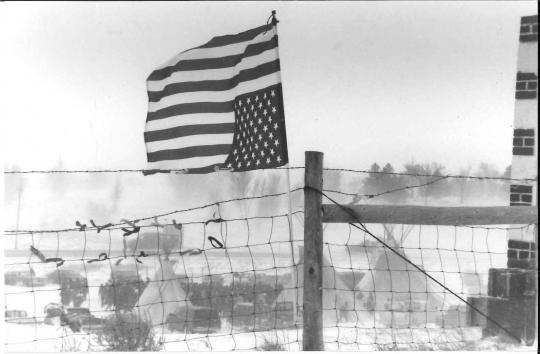  Upside-down American flag flying at Wounded Knee