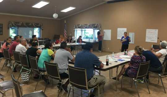 Color image of MCLA staff visit Marshall, Minnesota, for a listening session with residents, 2017.