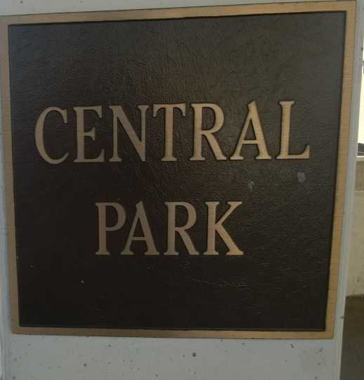 Color image of the plaque marking the location of St. Paul's Central Park, now the site of a parking lot at 54 Dr. Martin Luther King Jr. Blvd.