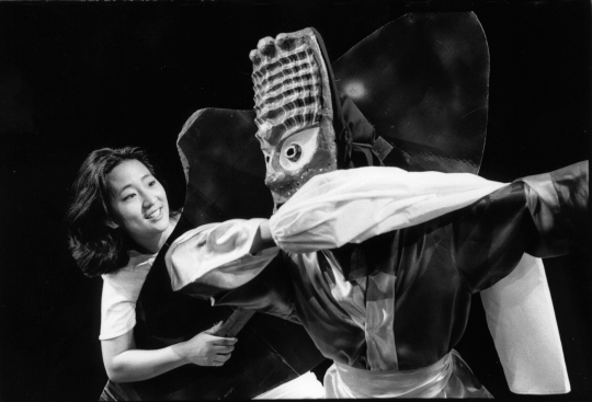 Color image of Shaman (Jennifer Weir) and Chwibari Dancer (Kaori Kenmatsu) in the Mu Performing Arts production of <em>Walleye Kid</em>, written by R. A. Shiomi and Sundraya Kase, directed by Rick Shiomi, 1998. Photographed by Charissa Uemara.