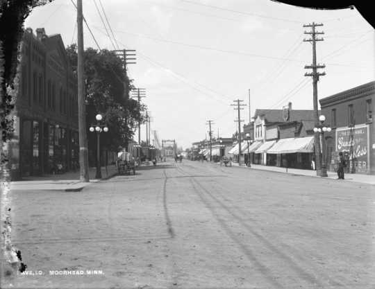 View (photograph) of Main Avenue from Fourth Street in Moorhead, ca. 1890s