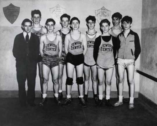 Black and white photograph of a young men's basketball team at the Jewish Educational Center in Saint Paul, c.1940. 