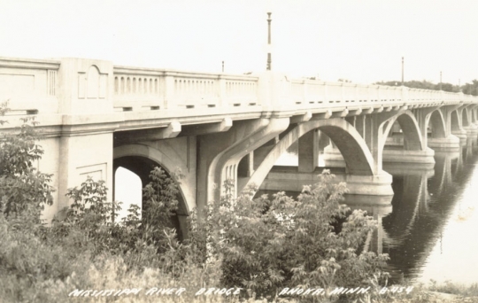 Black and white postcard image of the concrete Anoka–Champlin Mississippi River Bridge, ca. 1929. 