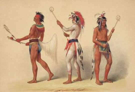 Native Americans with lacrosse sticks