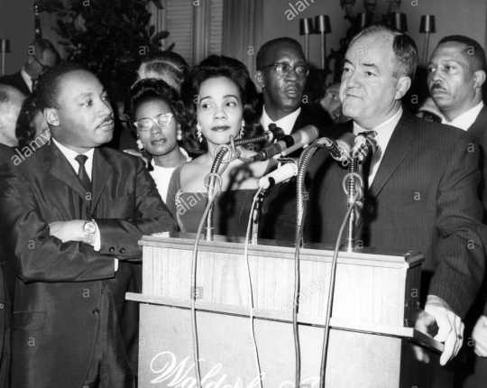 Black and white photograph of Martin Luther King and his wife, Coretta Scott King, with Vice President Hubert Humphrey, c. late 1960s.