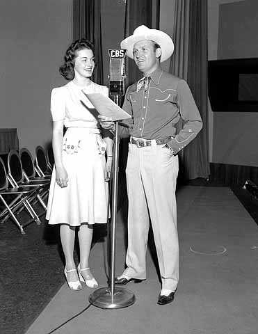 Queen of the Lakes Joyce Moen in Hollywood studios of CBS radio with Gene Autry.