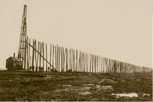 Black and white photograph of driving piles for the Stockwood Fill, spring 1906.