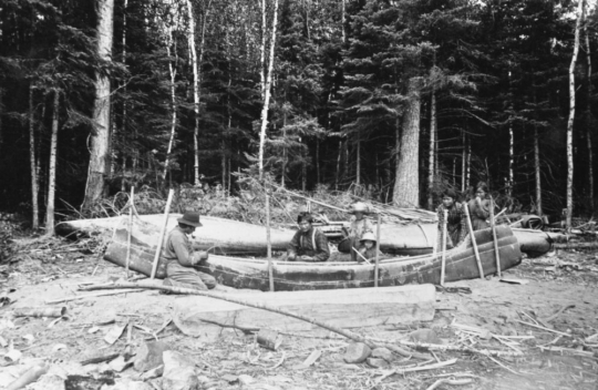 Ojibwe family making a canoe, Ely
