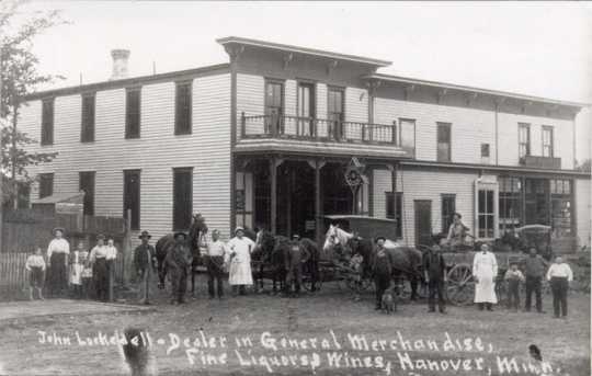 Black and white photograph of John Lockedell General Merchandise & Fine Liquors, ca. 1900–1910. 