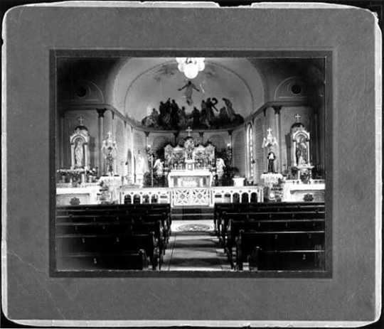 photograph of the altar and main aisle of St. Peter Claver