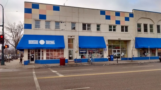 Color image of the exterior of Mercado Central, a cooperatively owned market featuring forty-five Latino-owned businesses at 1515 East Lake Street in Minneapolis, February 20, 2016. Photographed by Lizzie Ehrenhalt.