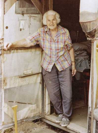 Color image of Dorothy Molter at the door of her summer tent on Knife Lake, ca. 1985.