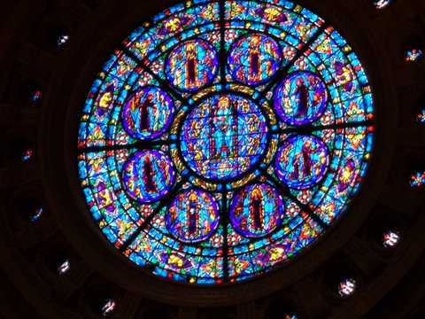 Color image of a north-facing, stained-glass rose window of the St. Paul Cathedral. Photographed by Paul Nelson on July 10, 2014.