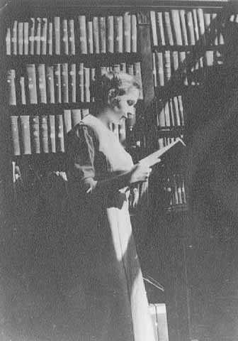 Gratia Countryman, librarian, in library stacks