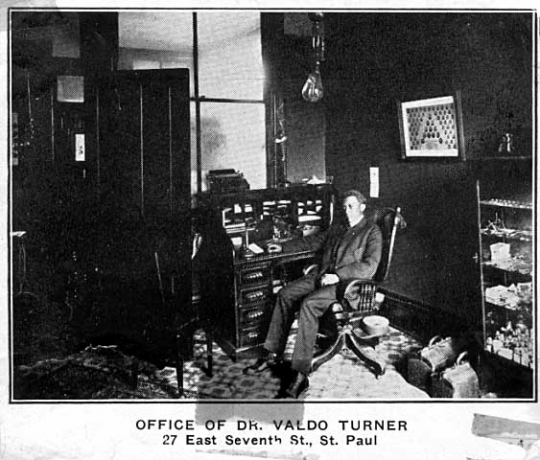 Black and white photograph of Dr. Valdo Turner in his office, c.1915.