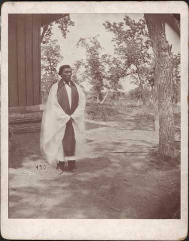 Black and white photograph of Enmegahbowh (Reverend John Johnson), c.1885.